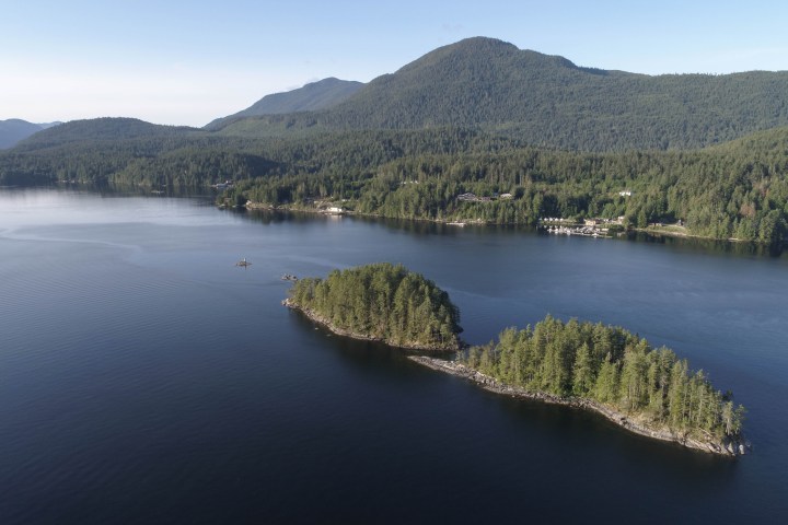 a body of water with a mountain in the background