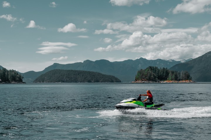 a group of people in a boat on a body of water