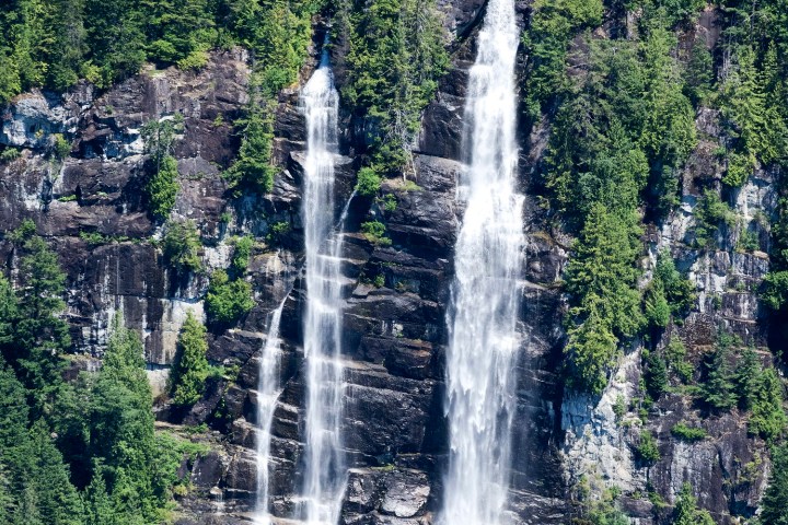 a large waterfall in a forest