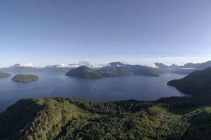 a view of a large body of water with a mountain in the background