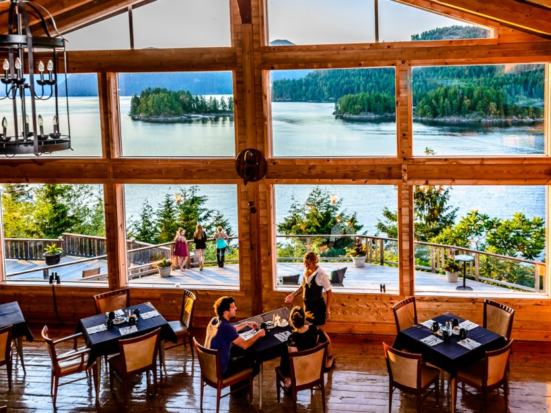 a living room filled with furniture and a large window