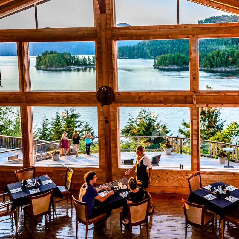 a living room filled with furniture and a large window